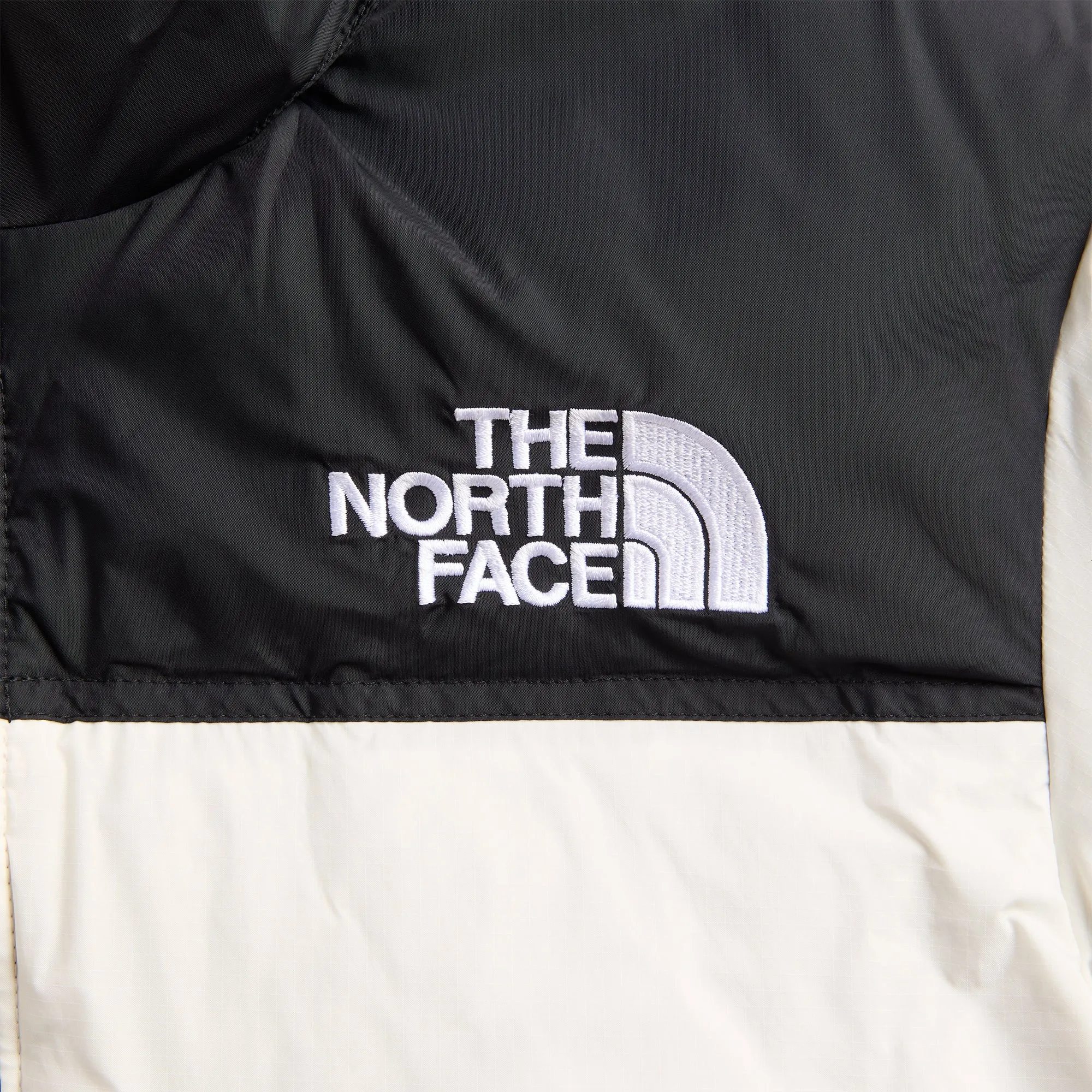 The North Face 1996 Retro Nuptse Jacket - White Dune / Black sold by Kith product image thumbnail 3