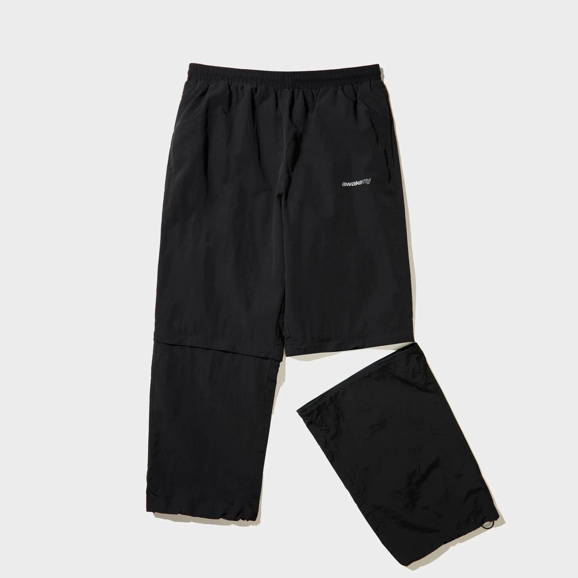 新品【AWAKE NY】トラックパンツ BLACK Awake NY Convertible Nylon Trackie - Black | Parallel
