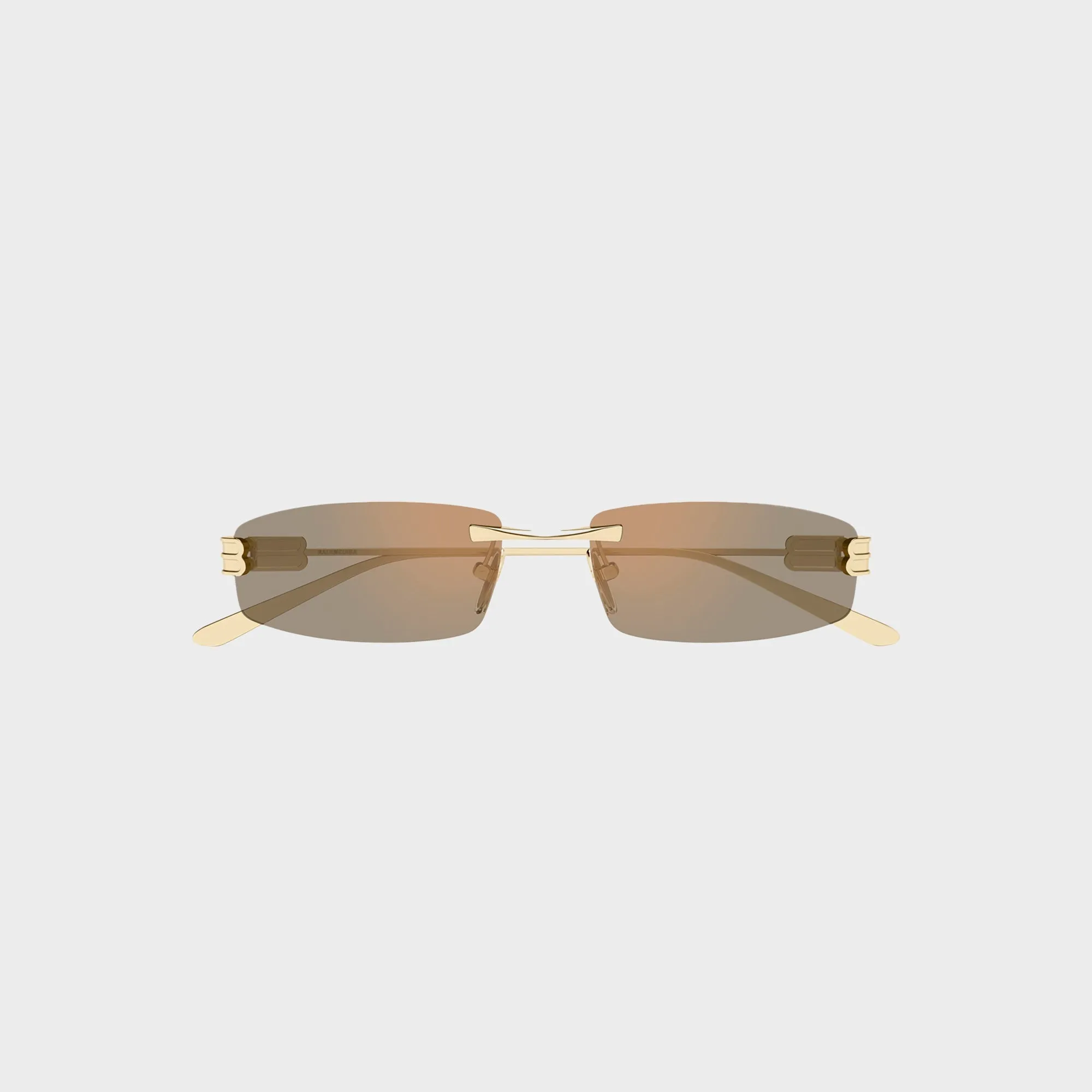 Balenciaga Metal Sunglasses - Gold / Pink sold by Kith