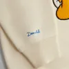 Disney | Kith for Mickey & Friends Donald Duck Vintage Crewneck - Sandrift sold by Kith