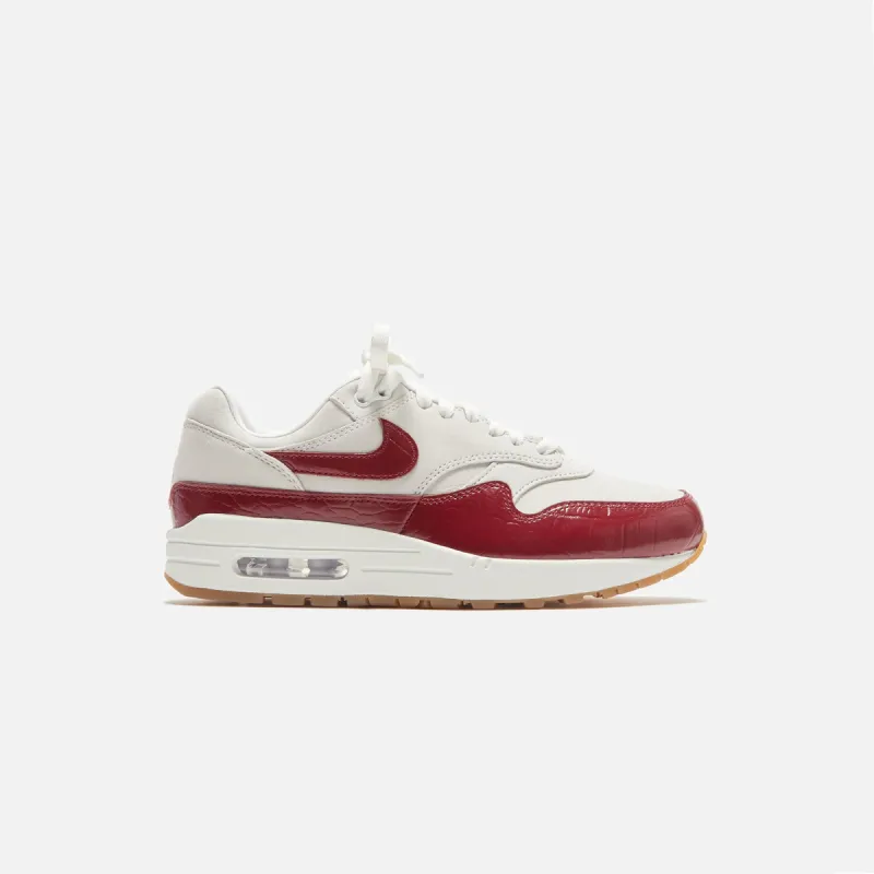 Nike WMNS Air Max 1 '87 - Sail / Gum Light Brown / Team Red sold by Kith
