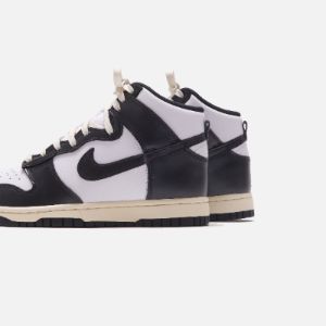 Nike WMNS Dunk High - White / Black / Coconut Milk sold by Kith