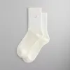 Kith Striped Mid Crew Socks With Script Embroidery - Sandrift sold by Kith