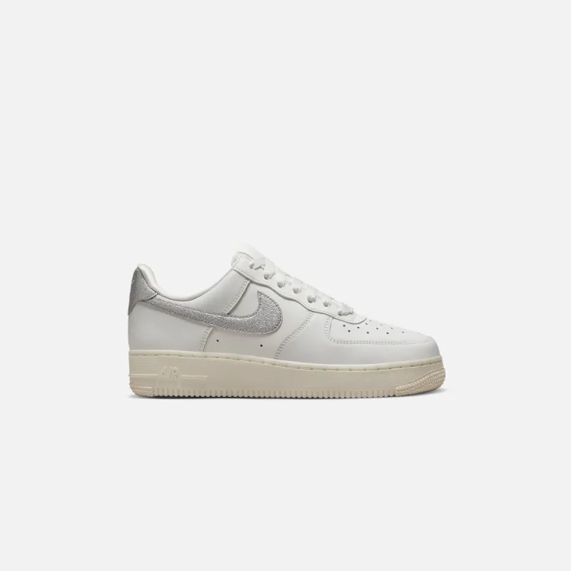Nike WMNS Air Force 1 `07 - Summit White / Metallic Silver sold by Kith