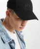 SIGN ON THE TIMES CAP BLACK sold by Ksubi