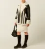 FLORENTINE LEATHER AND SHEARLING COAT sold by La CANADIENNE
