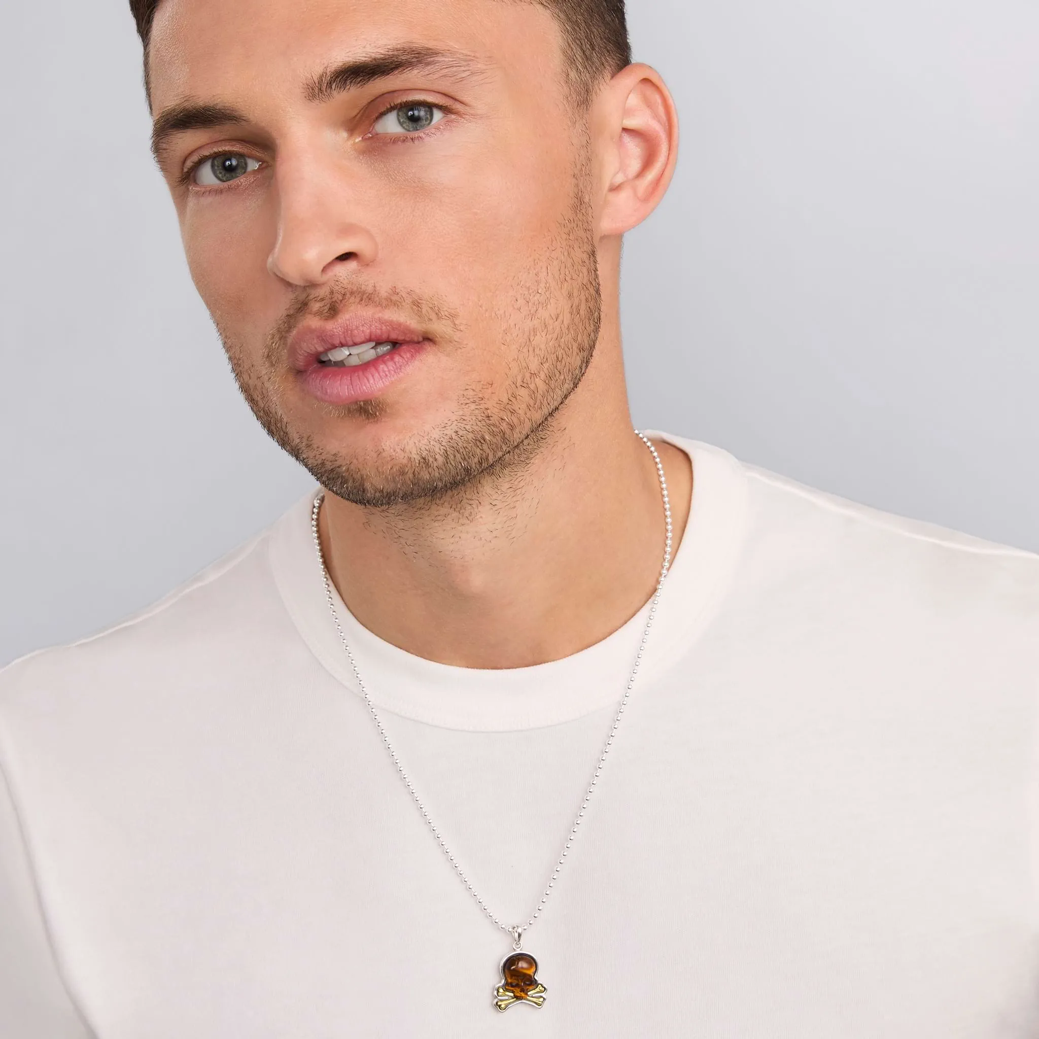 Anthem Two-Tone Tiger Eye Skull and Bones Amulet sold by LAGOS product image thumbnail 2