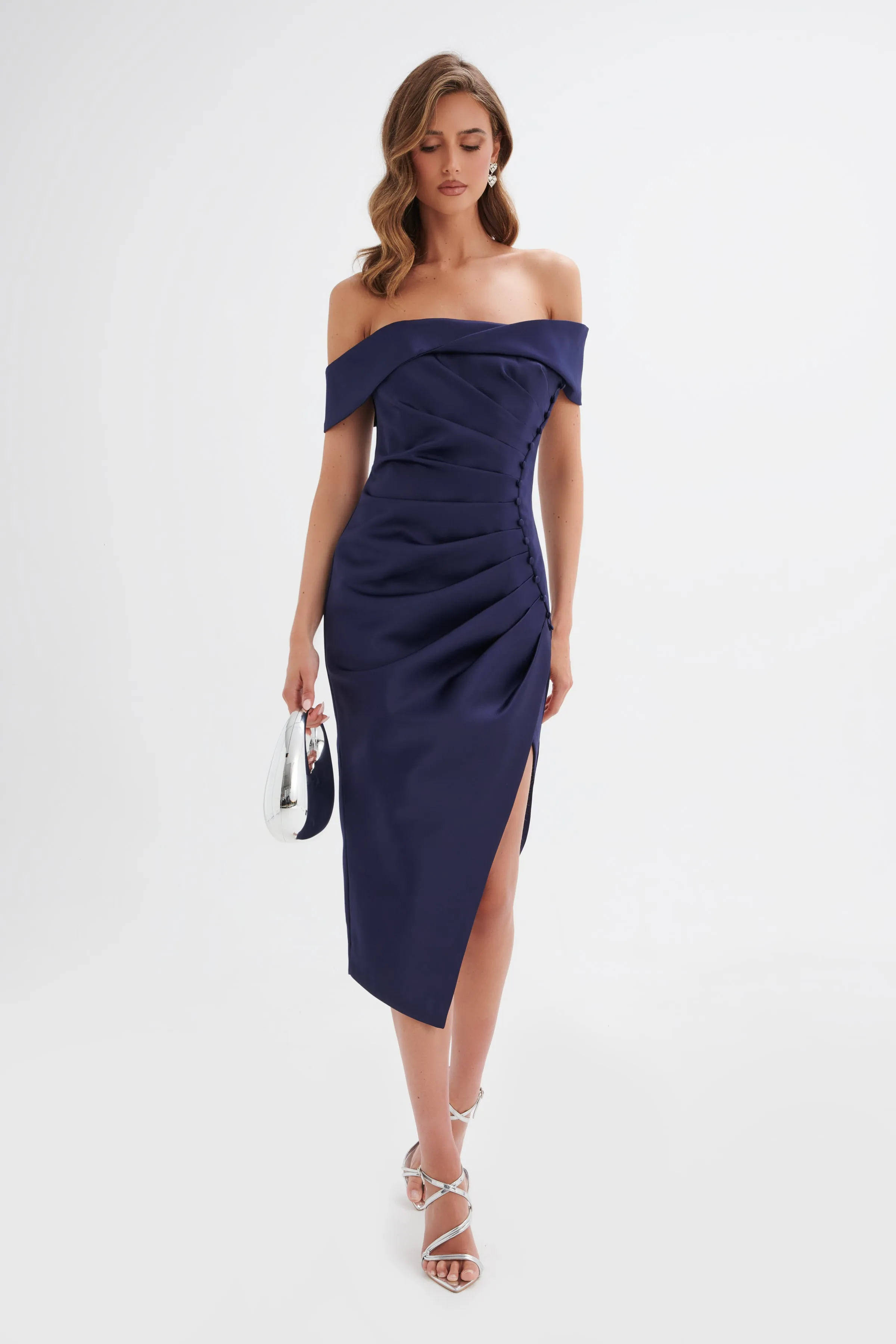 LUCILLE Twist Bardot Pleated Midi Dress in Navy sold by Lavish Alice