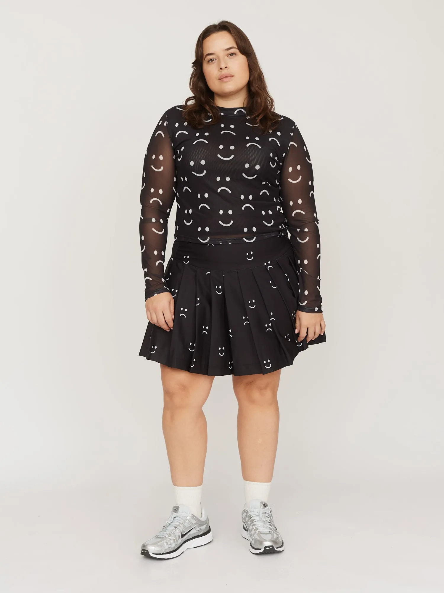 Mini Pleated Happy Sad Skirt sold by Lazy Oaf