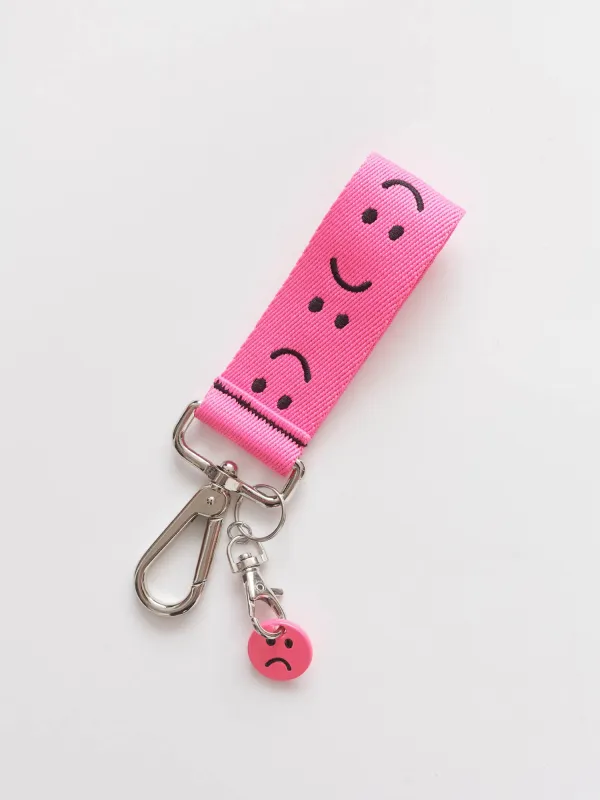 Pink Happy Sad Keyring sold by Lazy Oaf
