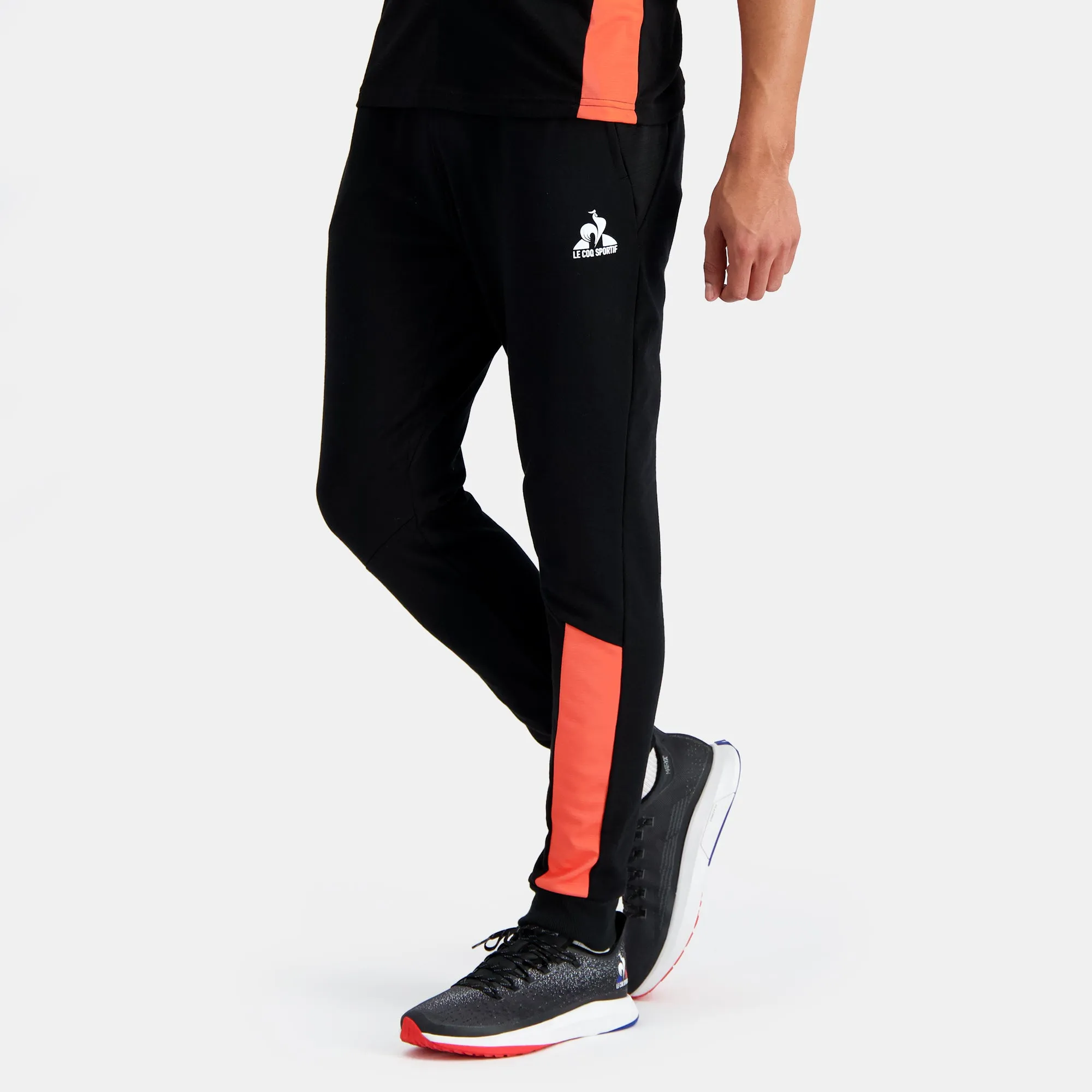 2410231-TRAINING SP Pant Regular N°2 M black/ora | Pantalon Homme sold by Le Coq Sportif
