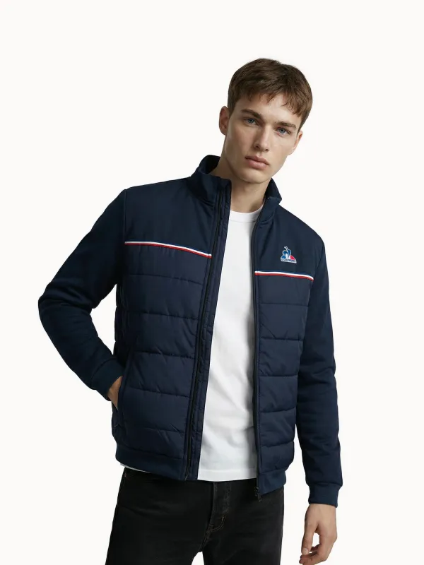 Veste zippée matelassée bi-matière avec détail tricolore made by Le Coq Sportif