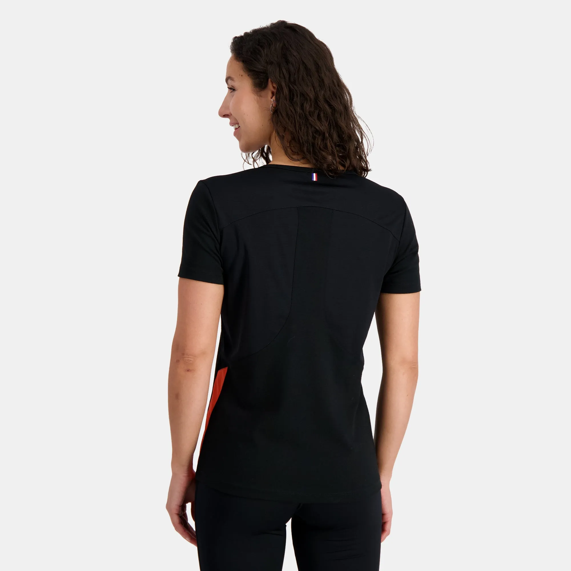 2410233-TRAINING Tee SS N°1 W black/orange perf | T-shirt Femme sold by Le Coq Sportif product image thumbnail 5