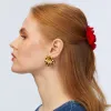 GOLD PINWHEEL FLOWER BUTTON EARRINGS sold by Lele Sadoughi
