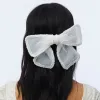 PORCELIN MARY PEARL EMBELLISHED BOW BARRETTE sold by Lele Sadoughi