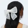 PORCELIN MARY PEARL EMBELLISHED BOW BARRETTE sold by Lele Sadoughi