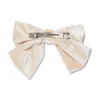 IVORY JUMBO VELVET BOW BARRETTE sold by Lele Sadoughi