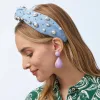 LIGHT DENIM PEARL BEZEL KNOTTED HEADBAND sold by Lele Sadoughi