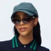 CHARCOAL FAUX LEATHER BASEBALL CAP sold by Lele Sadoughi