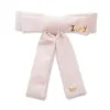 PINK VELVET ANTOINETTE BOW BARRETTE sold by Lele Sadoughi