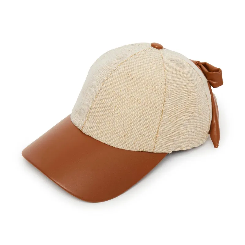NATURAL FAUX LEATHER CANVAS BASEBALL CAP sold by Lele Sadoughi