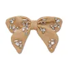 NATURAL LIBBY CANDY CRYSTAL RAFFIA BOW sold by Lele Sadoughi