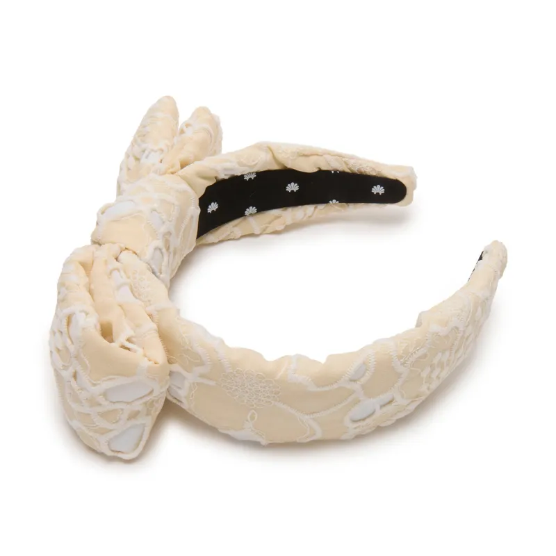 NATURAL HOLLY FLORAL EYELET HEADBAND sold by Lele Sadoughi