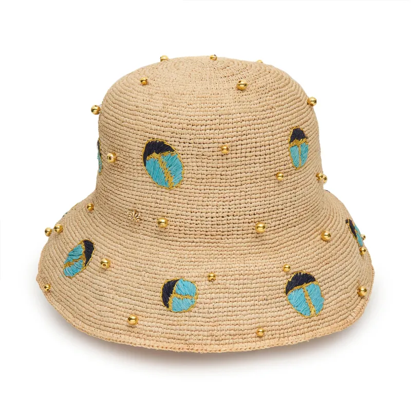 TURQUOISE LAPIS SCARAB EMBELLISHED RAFFIA BUCKET HAT made by Lele Sadoughi