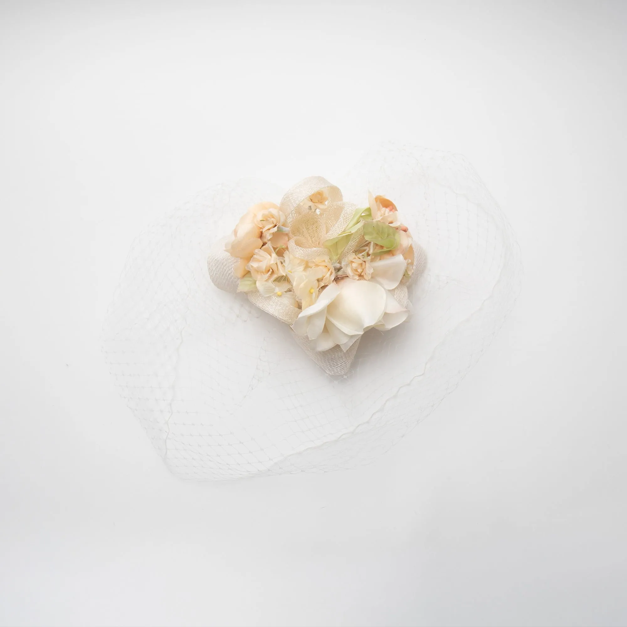 GOLDEN IVORY FLORAL BOUQUET VEIL FASCINATOR sold by Lele Sadoughi