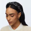 GOLD RUFFLED LILY STUD EARRINGS sold by Lele Sadoughi