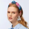 SUNSET RAINBOW RAFFIA KNOTTED HEADBAND sold by Lele Sadoughi