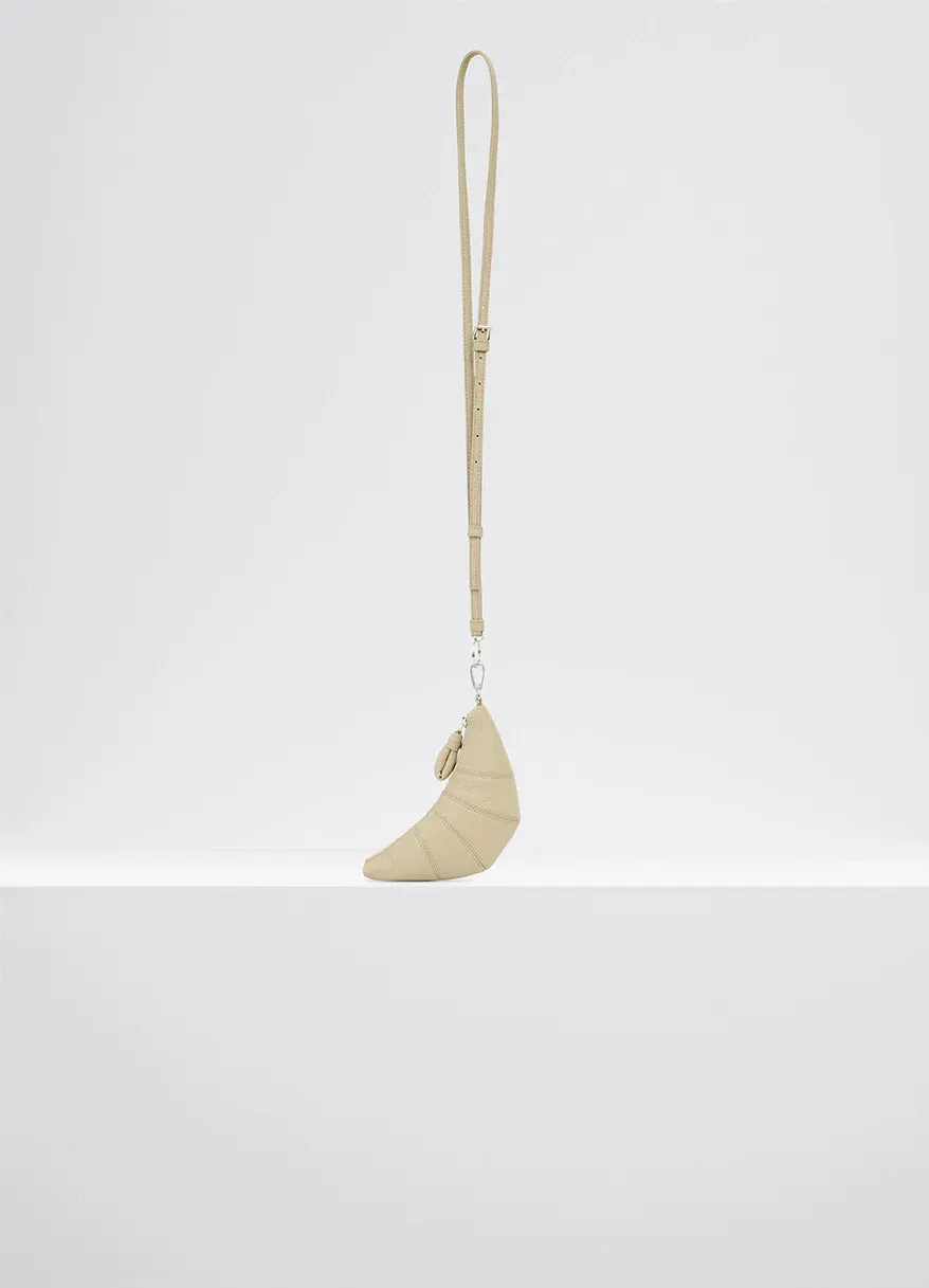 CROSS-BODY CROISSANT COIN PURSE IN LEATHER sold by Lemaire