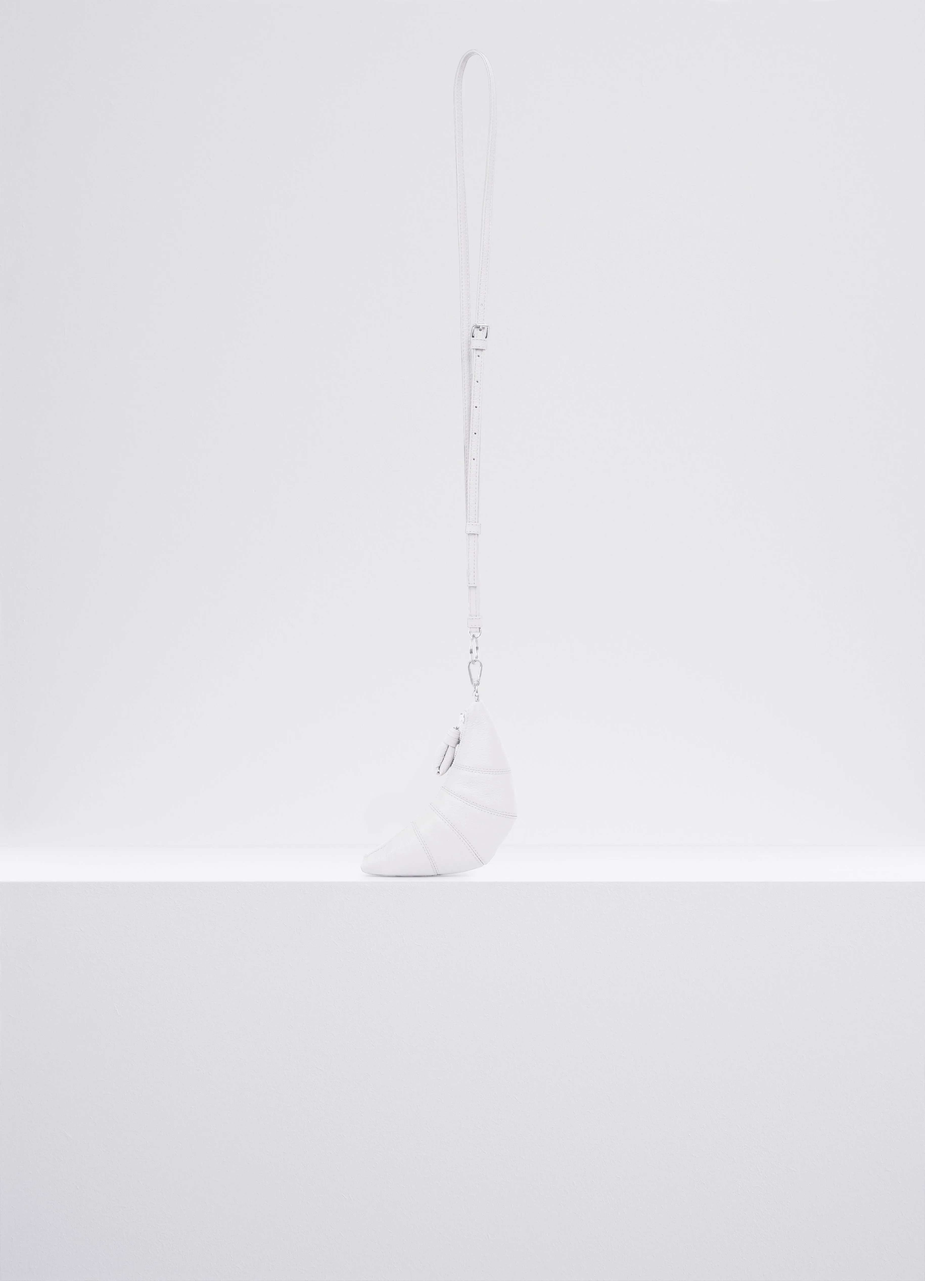 CROSS-BODY CROISSANT COIN PURSE IN LEAYHER sold by Lemaire