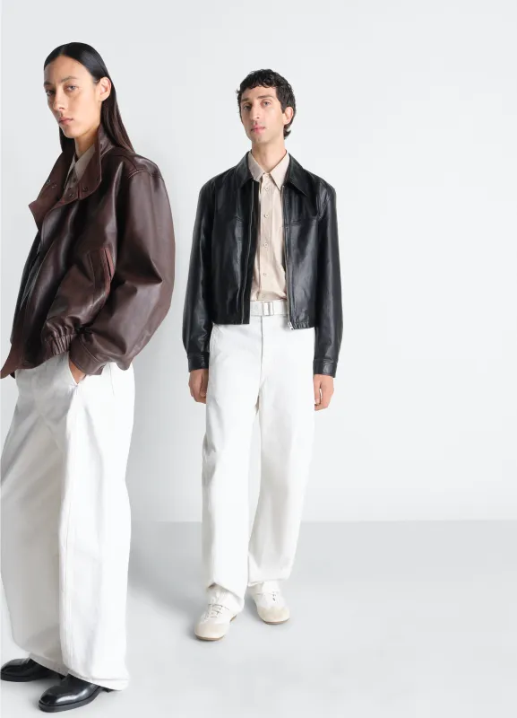 TWISTED BELTED PANTS IN DENIM sold by Lemaire