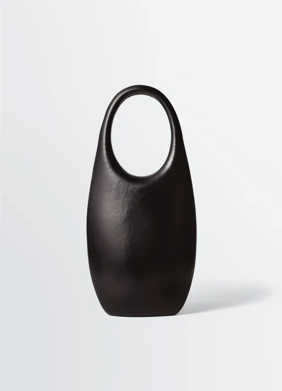 CARLOS PEÑAFIEL NAHO BAG IN MOLDED LEATHER made by Lemaire
