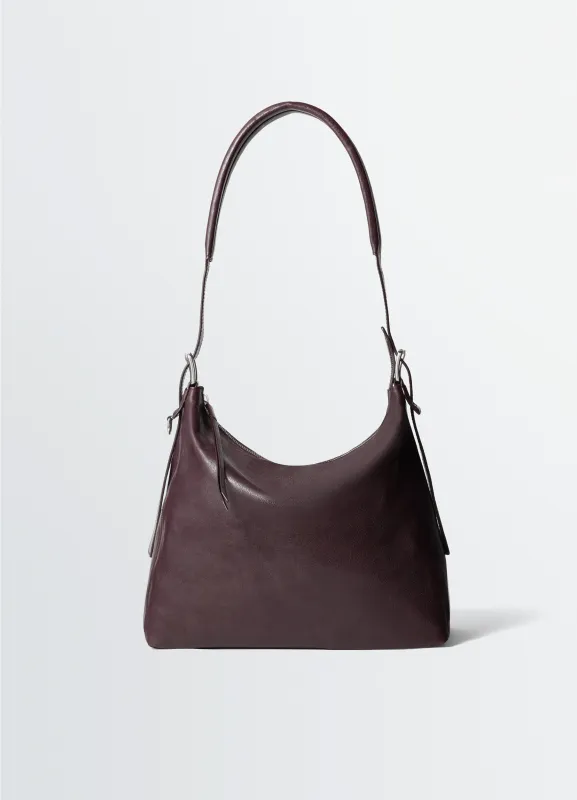 SMALL BELTED HOBO BAG IN LEATHER made by Lemaire