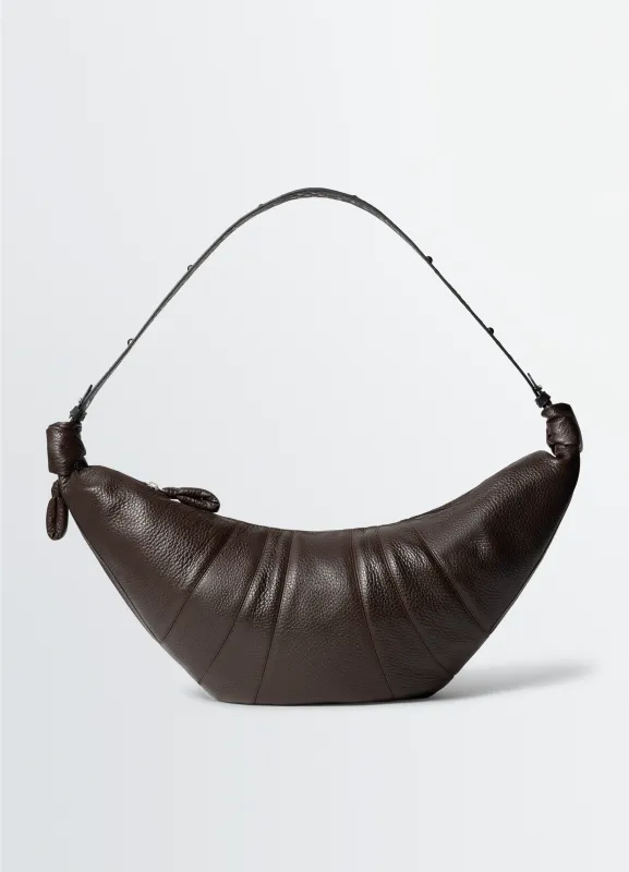 WESTERN STUDS LARGE CROISSANT BAG IN LEATHER sold by Lemaire