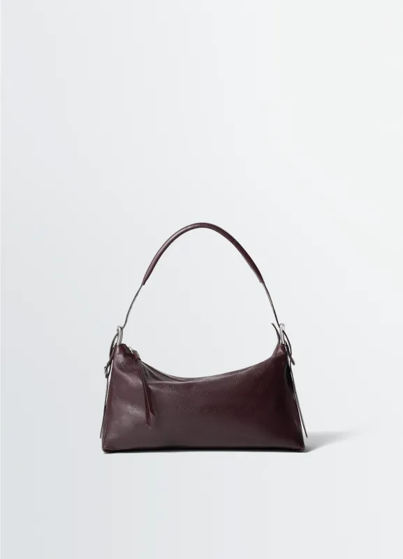 BELTED BAGUETTE BAG IN LEATHER made by Lemaire