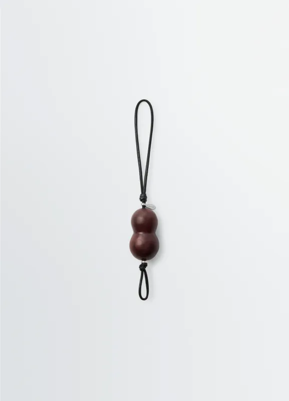 PEANUT HEEL CHARM IN LEATHER sold by Lemaire