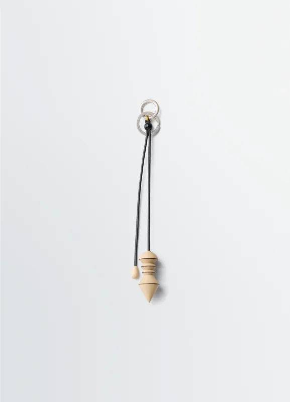 PENDULUM BAG CHARM IN WOOD sold by Lemaire