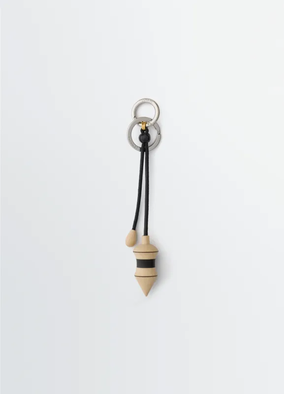 BLACK STRIPES PENDULUM BAG CHARM IN WOOD WITH CORD sold by Lemaire