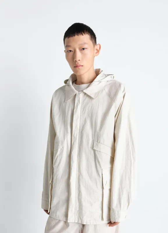 RAIN JACKET WITH DETACHABLE HOOD IN COATED TECHNICAL LINEN made by Lemaire