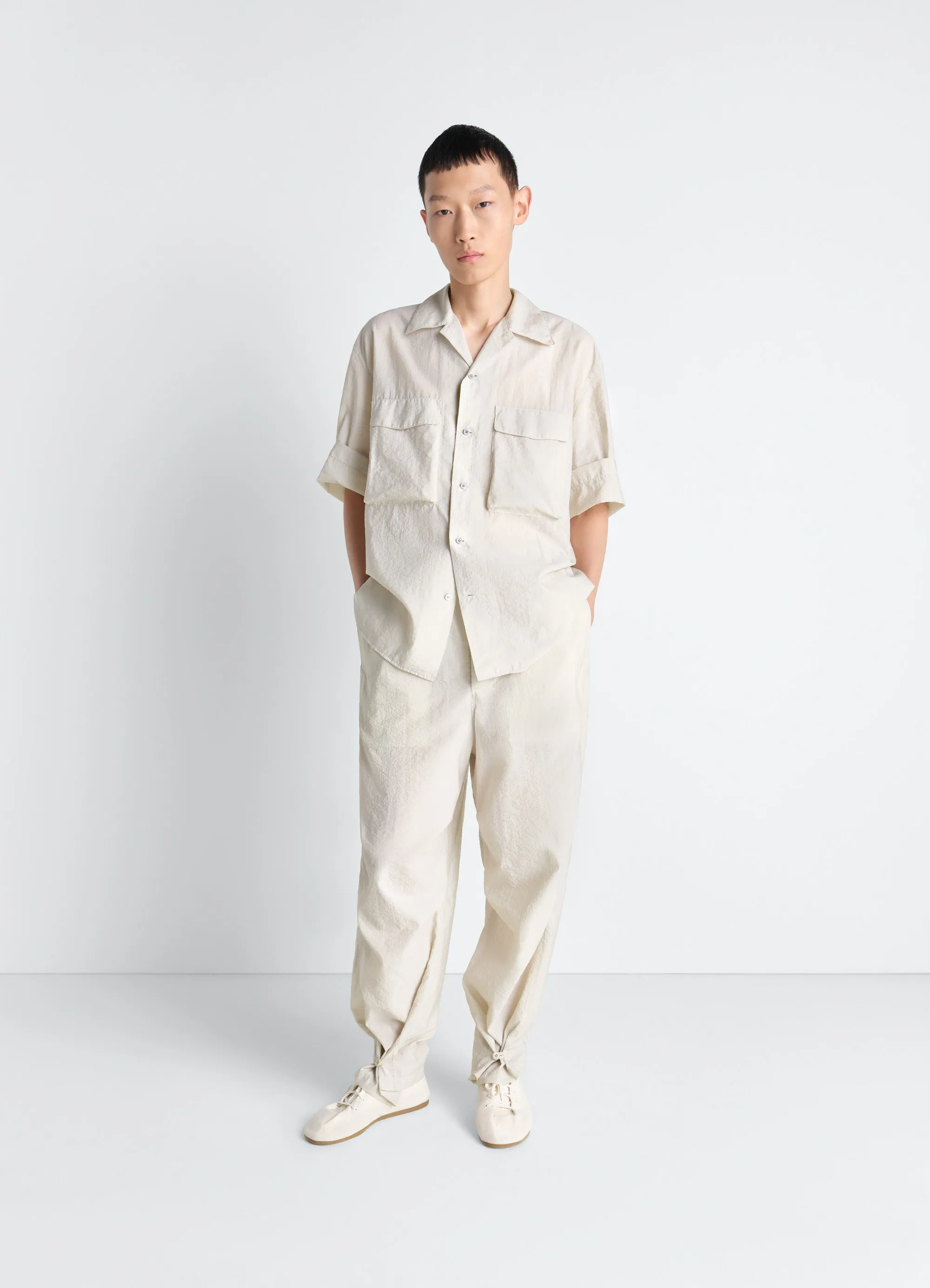 PARACHUTE PANTS IN WASHED TECHNICAL COTTON sold by Lemaire
