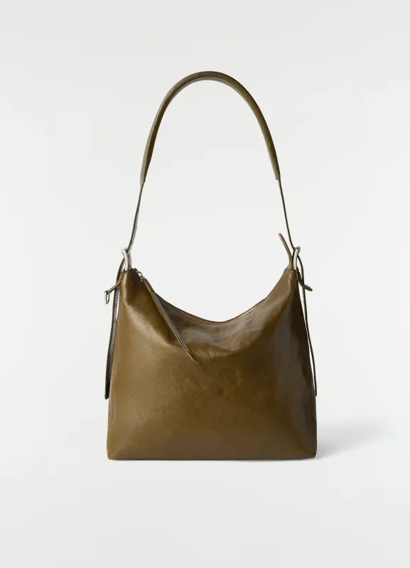 SMALL BELTED HOBO BAG IN LEATHER made by Lemaire