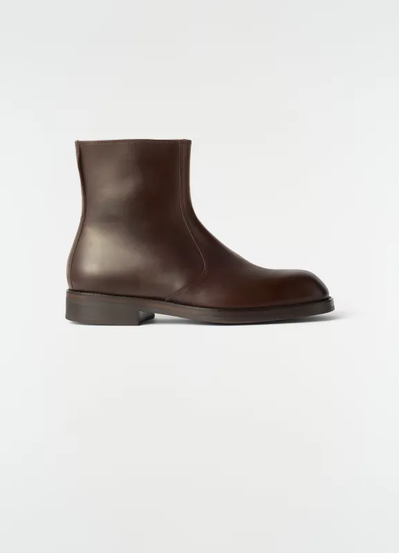 ZIPPED ANKLE BOOTS IN SHINY LEATHER made by Lemaire