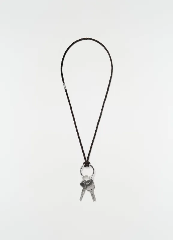 KEYRING NECKLACE WITH BRAIDED RECYCLED LEATHER CORD made by Lemaire