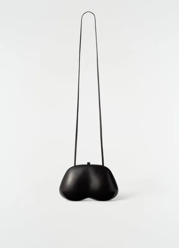 FESSES CLUTCH IN PATINATED CALFSKIN made by Lemaire