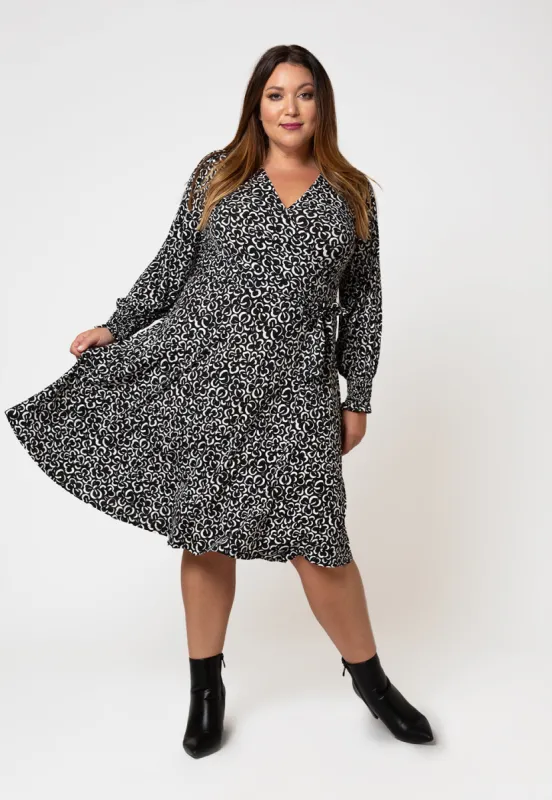 Leota Women's Long Sleeve Perfect Wrap Midi Dress in Graphic Gardenia (Curve) White sold by Leota