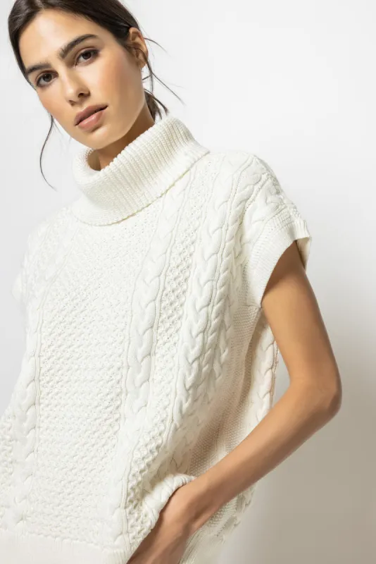 Cable Poncho sold by Lilla P