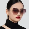 Loni Cat Eye Sunglasses in Yellow Gold and Grey sold by Linda Farrow